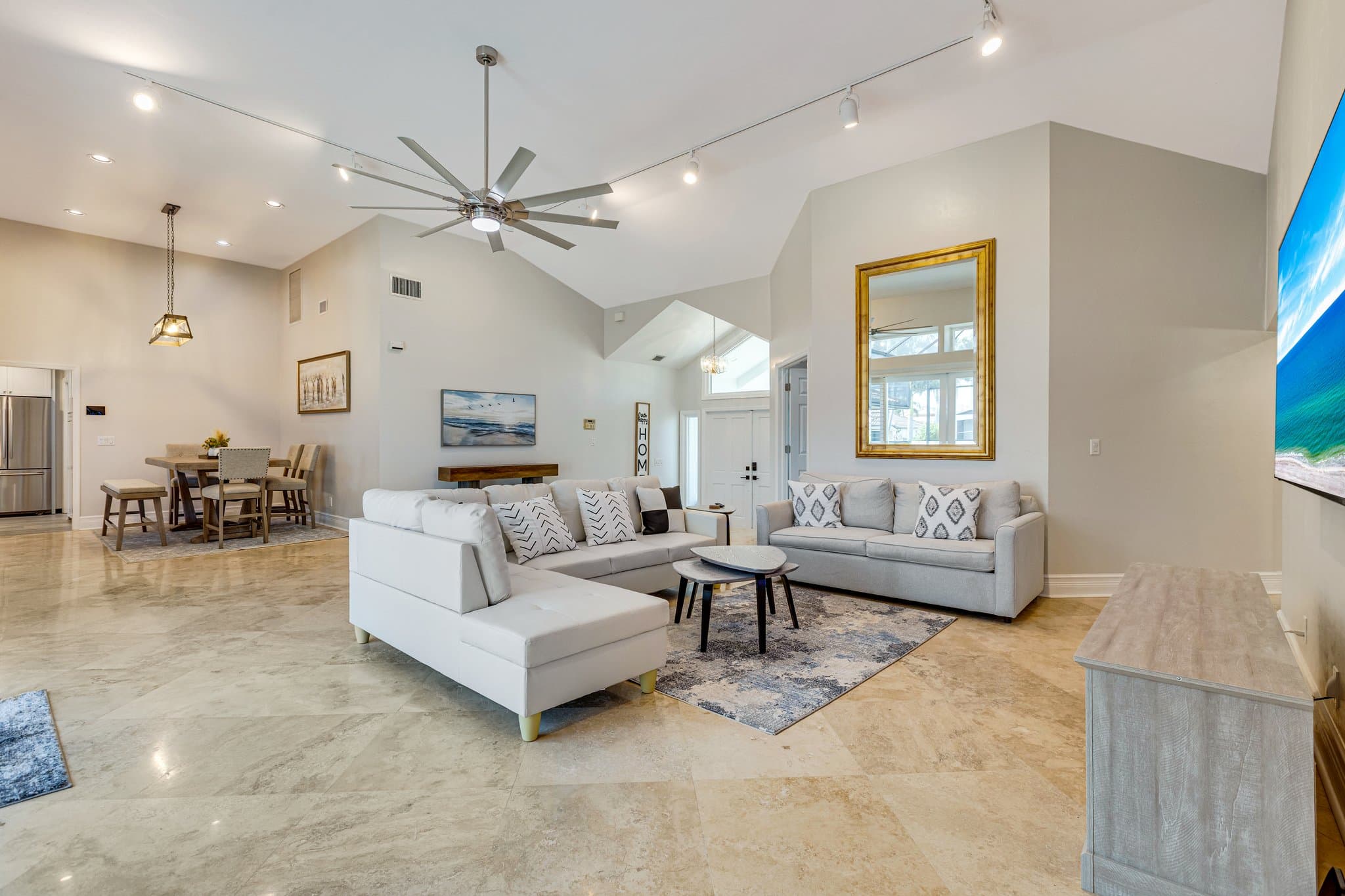Main living room with sectional seating and vaulted ceiling