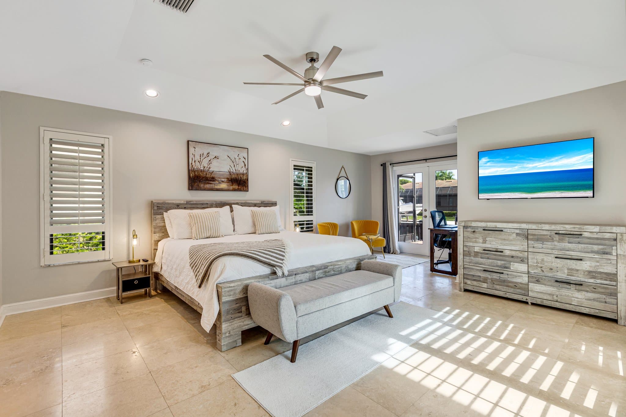 Primary bedroom with king bed, smart TV and lanai access