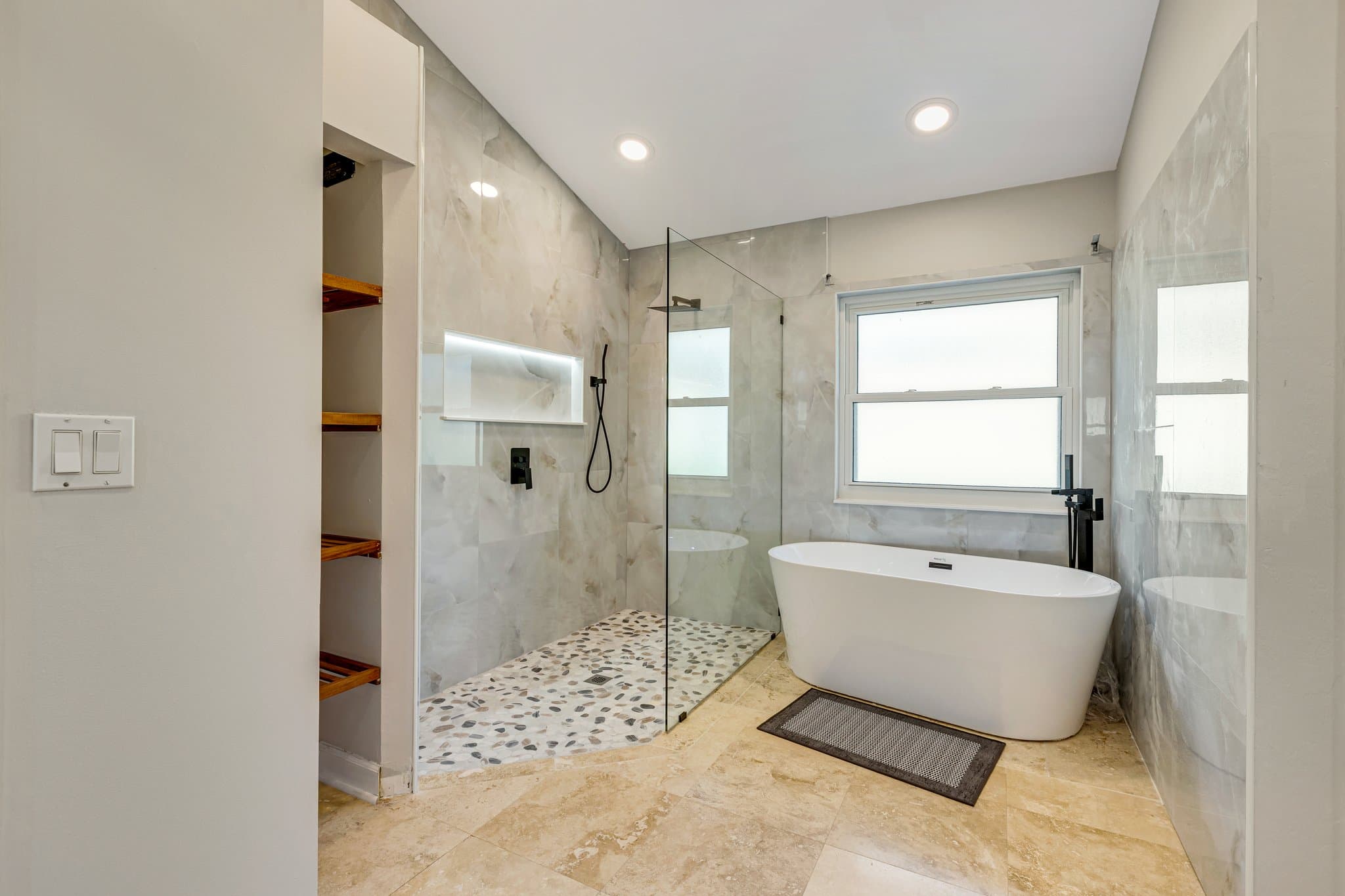 Primary en-suite with walk-in shower and freestanding soaking tub