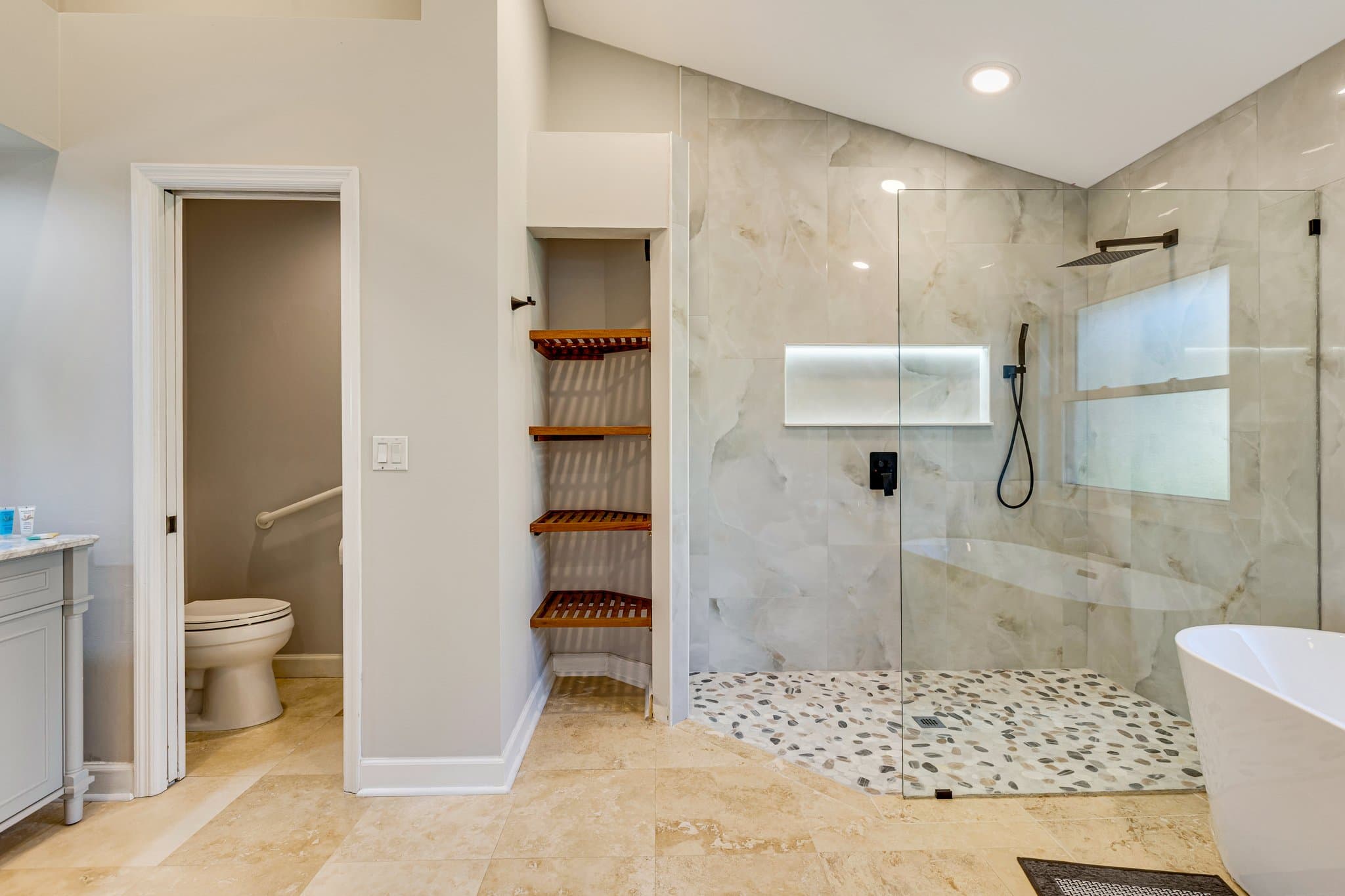 Primary en-suite walk-in shower and separate water closet