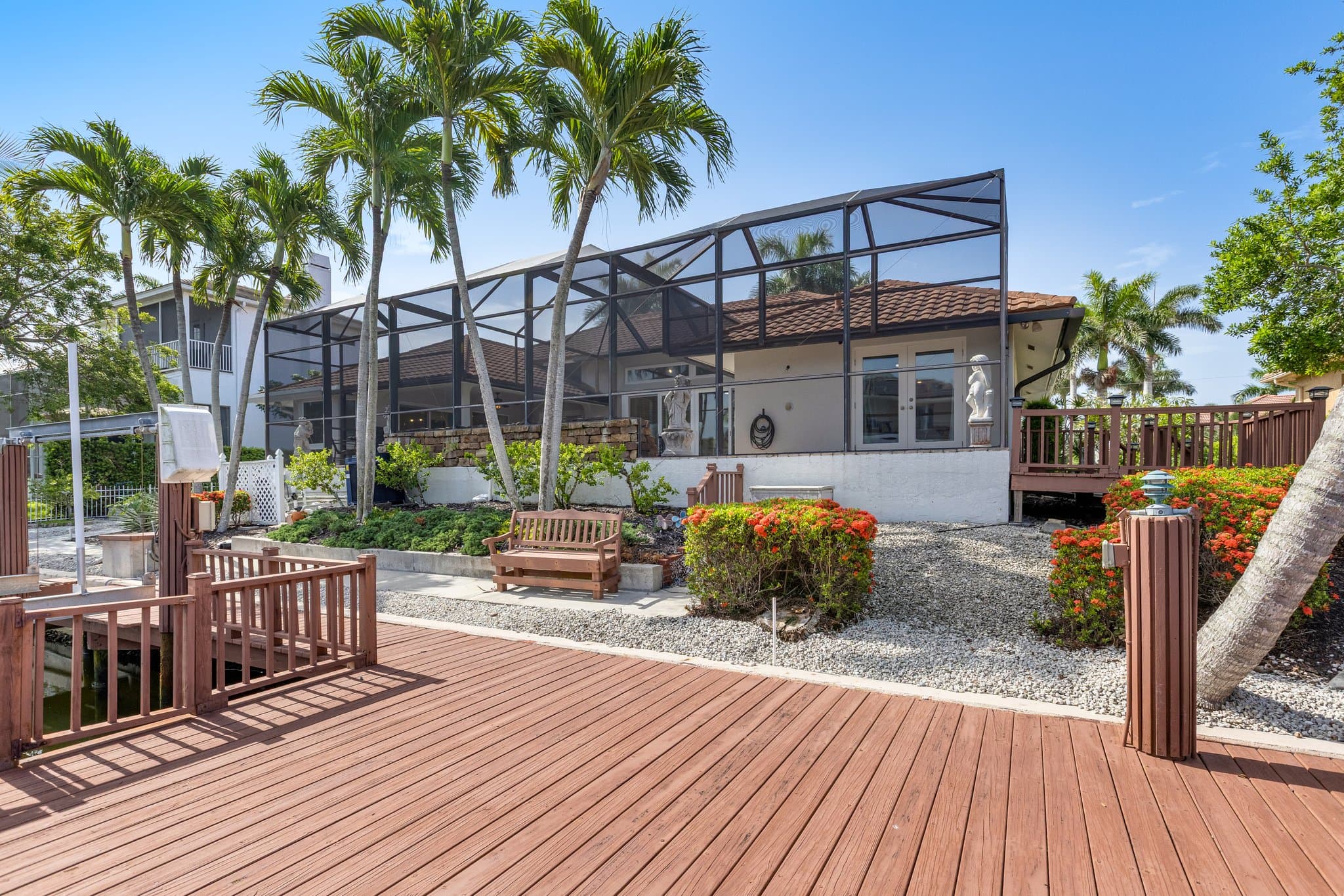 View from the dock back toward the pool cage and house