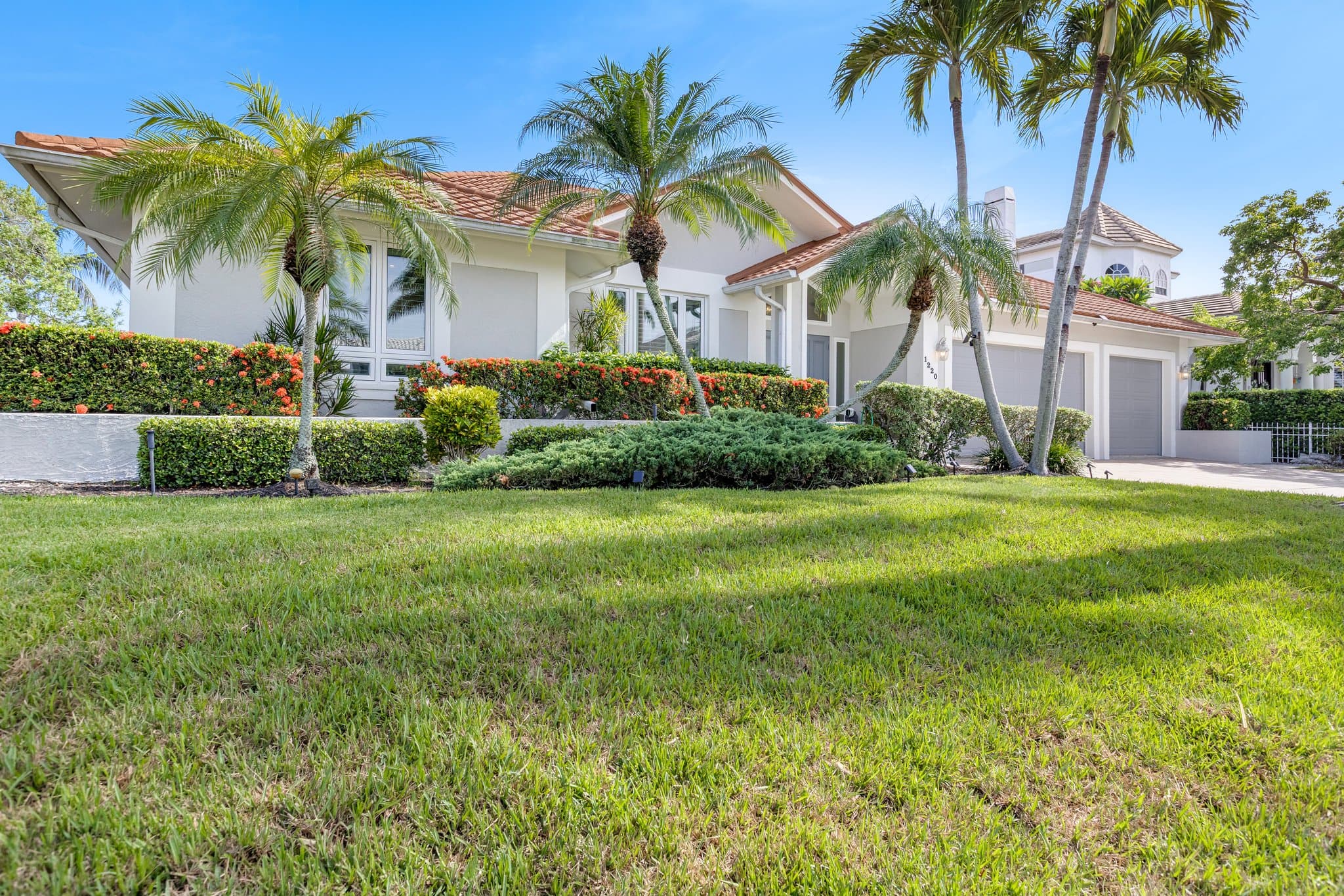 Street view of the home and front lawn