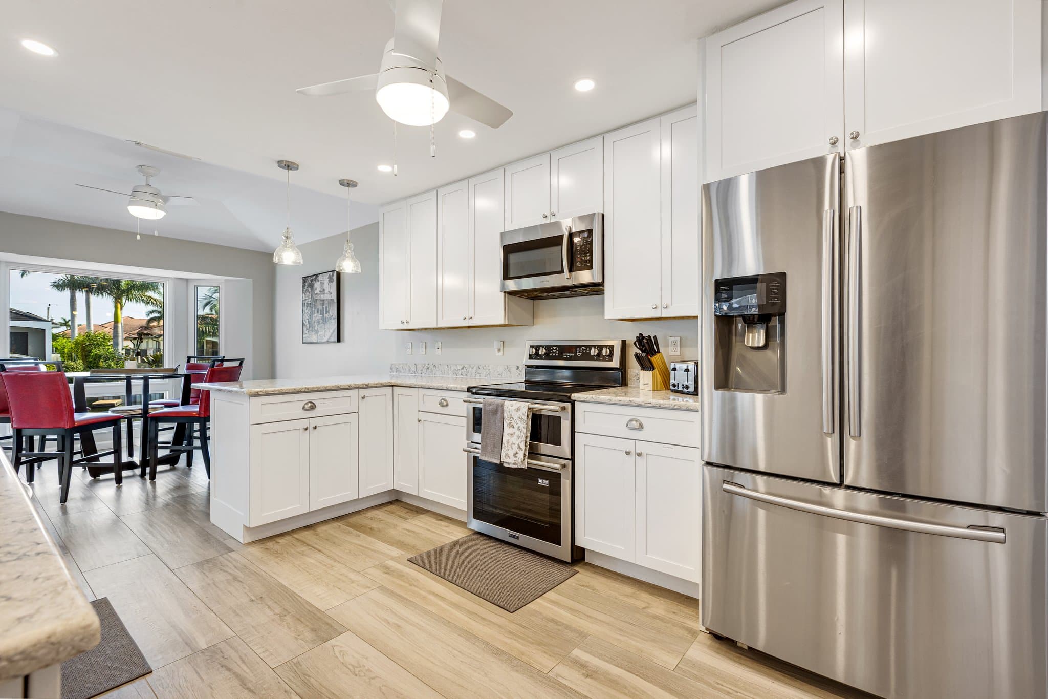 Kitchen with stainless refrigerator, range and microwave